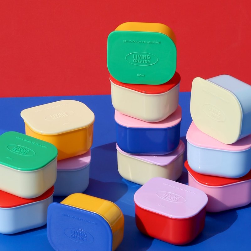 Mini sauce containers stacked in many colors